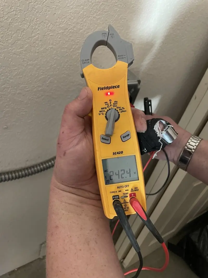 Voltage testing with clamp meter during Whole House Surge Protector in Mineola